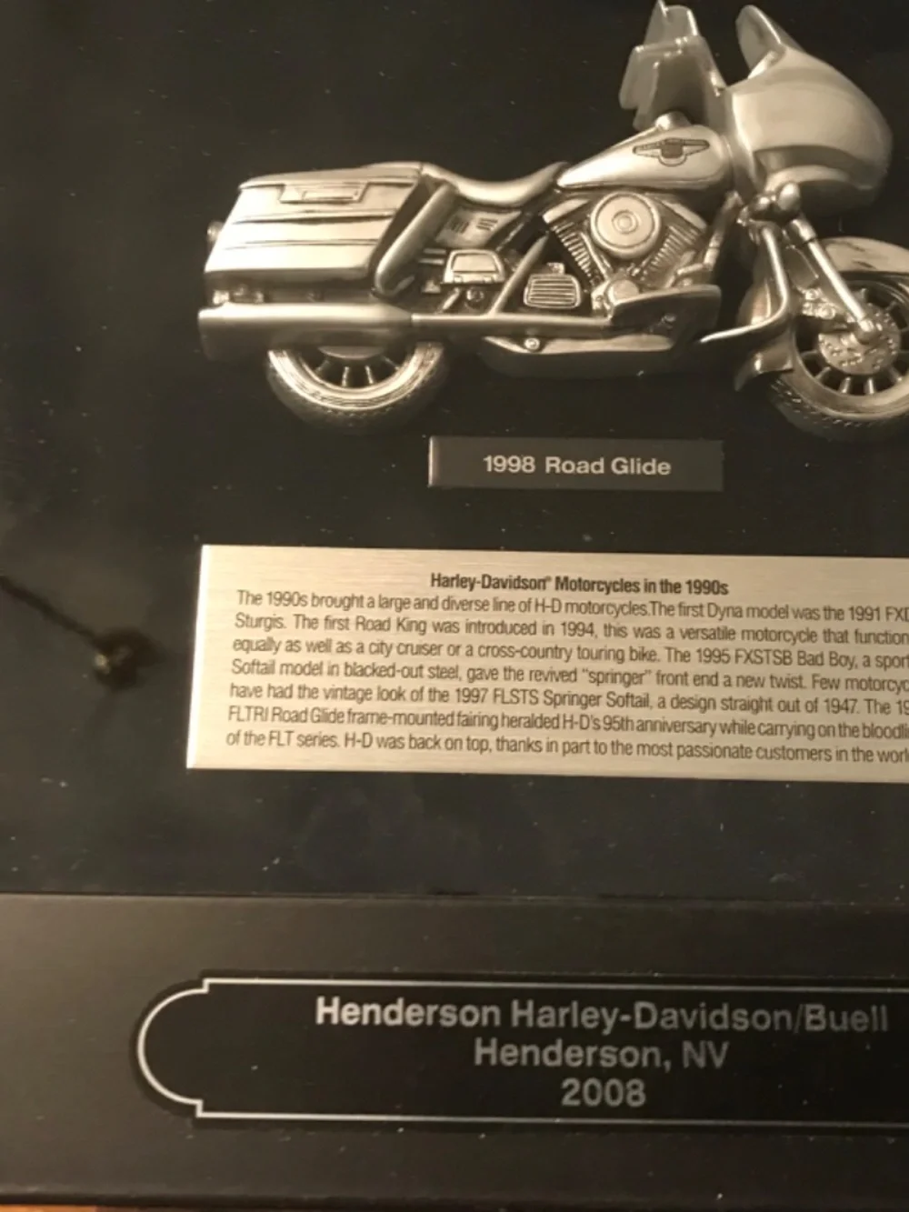 Framed Harley Davidson memorabilia